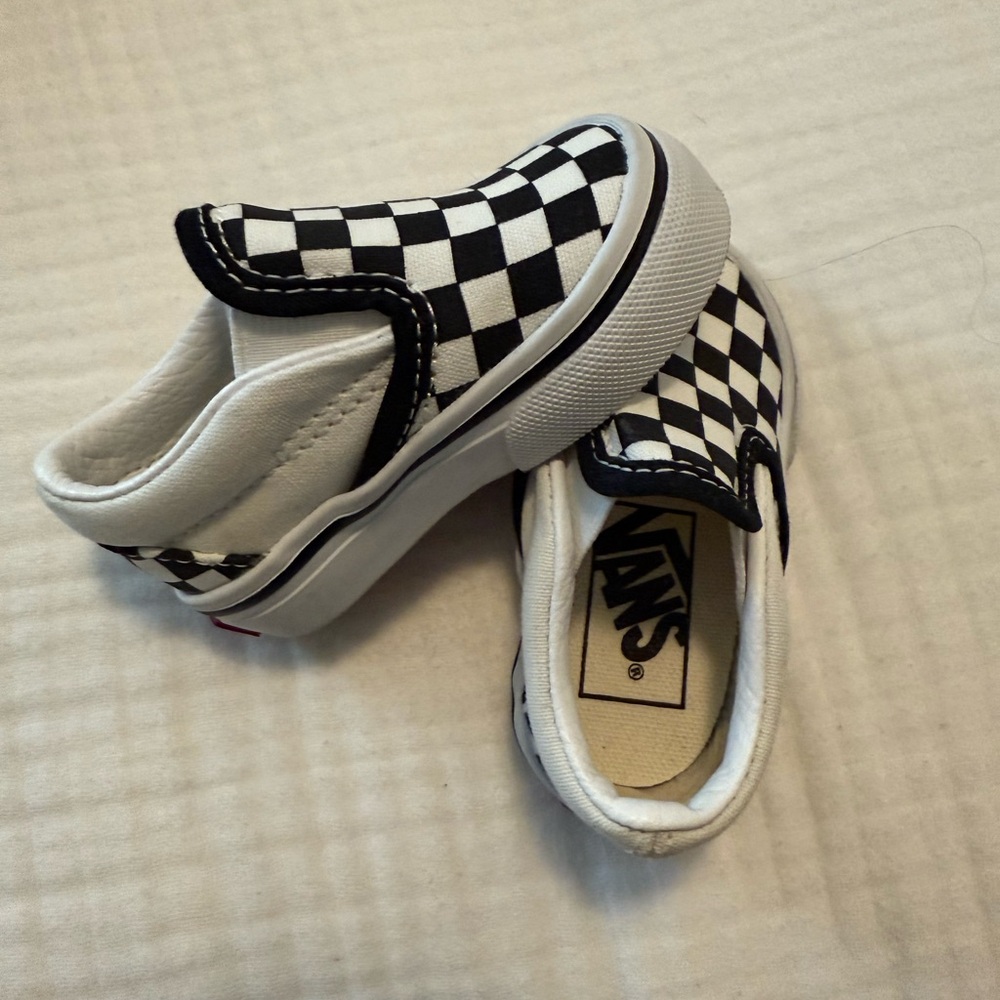 Vans Black and White Checkerboard Slip-On Sneakers